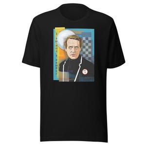 May include: Black t-shirt with a colorful graphic of a man with the text "I am not a number".