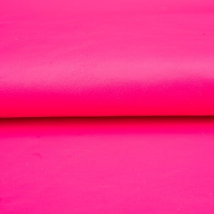Natural look leather sheets in bright magenta pink color. Genuine leather panels