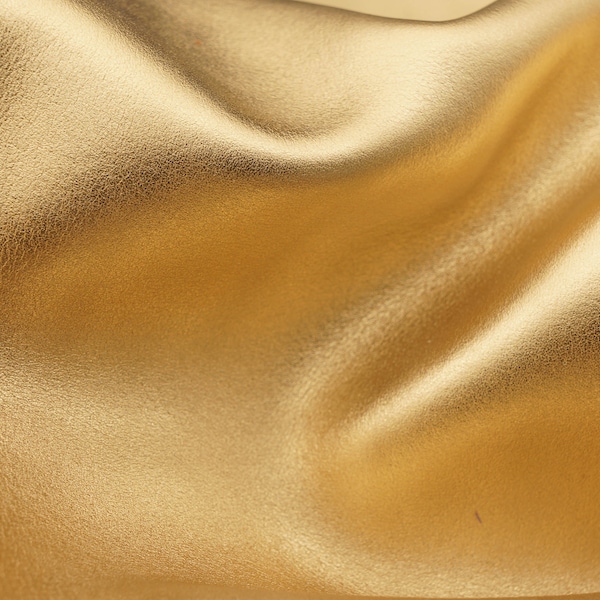 Gold leather pieces with metallic look. High quality nappa genuine leather sheets in golden color for diy crafts