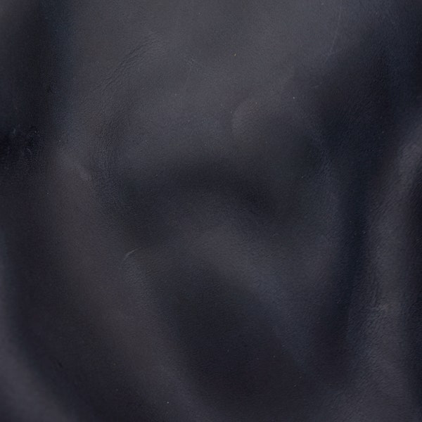 Crazy horse leather sheets in very dark gray blue with vintage look. Full grain, semi veg tan, high quality pull up leather pieces