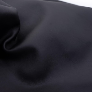 Black nappa leather sheets. Soft smooth, natural face genuine leather pieces for diy crafts in black color
