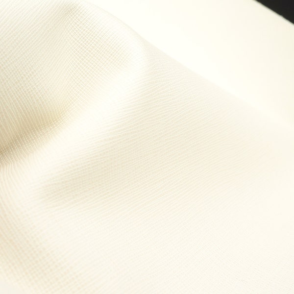 1.1mm/ 2oz ivory white Saffiano leather sheet. Strong, fashionable, easy to clean, waterproof genuine leather great for wallets and bags