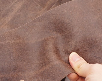 Antique look real leather sheet in brown chestnut. Strong grain leather piece with vintage discrete pull up effect