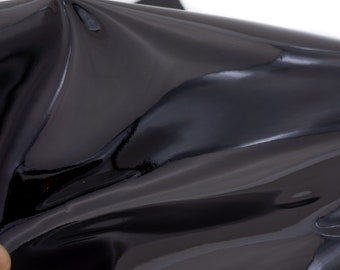 Patent leather sheets in black for diy crafts. Glossy genuine leather pieces