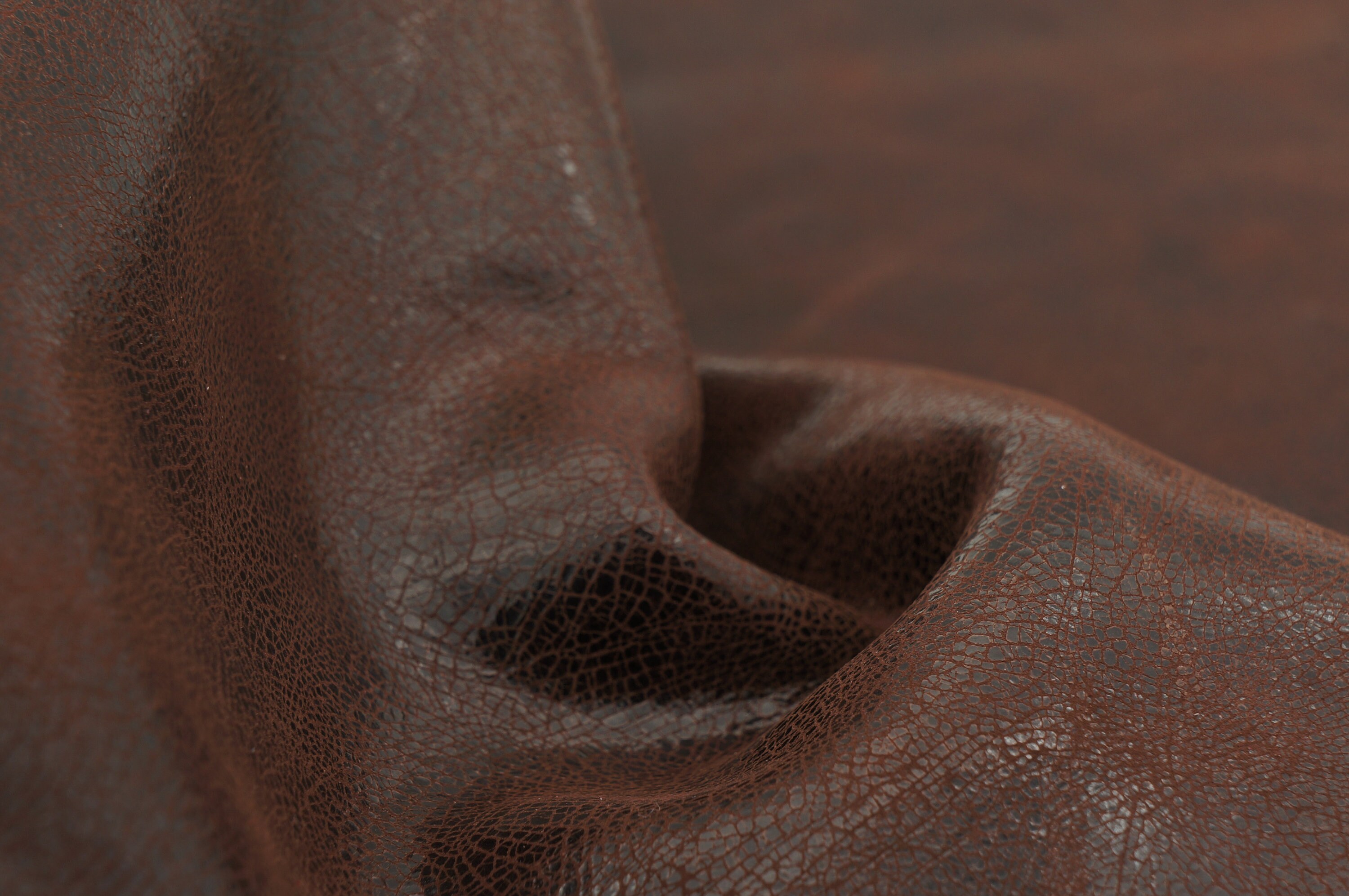 Pull up leather sheets in dark chocolate brown. Antiqued, varnished genuine  leather pieces with vintage look and distressed effect