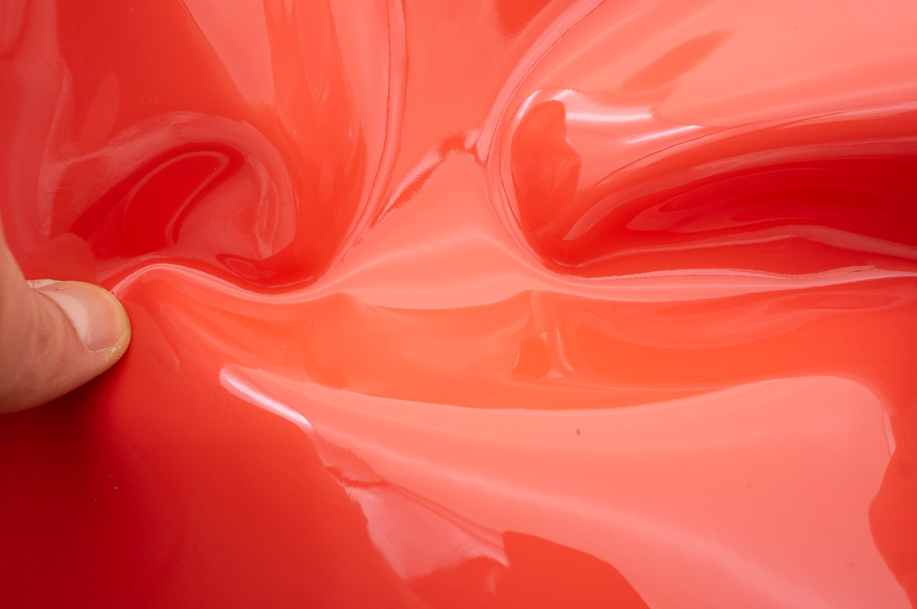 Patent leather pieces in dark salmon pink for diy crafts. High quality glossy genuine leather sheets in coral pink