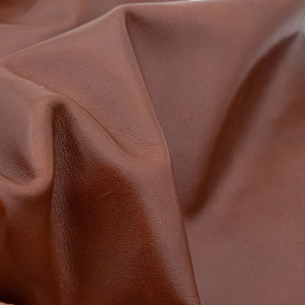 Nappa leather sheets in dark cognac brown, 1.1mm/2-3oz. Soft and smooth genuine leather in brown color with discrete clouded pattern