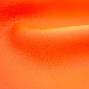 Bright orange nappa leather sheets with matte surface. Good quality soft, napa genuine leather pieces for diy crafts