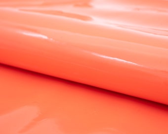 Light salmon pink patent leather pieces. Glossy genuine leather sheets in coral color