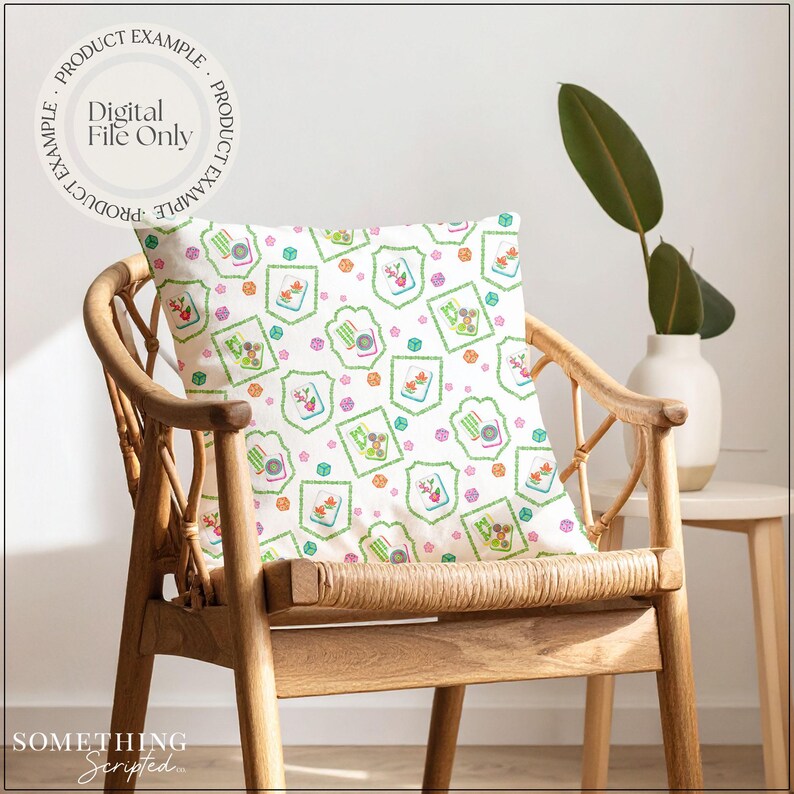 May include: A decorative pillow with a repeating pattern of green, pink, and orange floral and geometric designs. The pillow is on a wooden chair. The text "PRODUCT EXAMPLE" and "DIGITAL FILE ONLY" are printed on the top left of the image. The text "SOMETHING SCRIPTED" is printed on the bottom left.