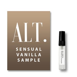 May include: A Sensual Vanilla fragrance sample vial next to a card. The card has a gradient brown background with the word "ALT." in large white letters. The words "SENSUAL VANILLA SAMPLE" are also in white.
