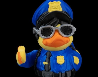 Quop, patito de goma, policía