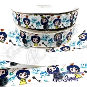 May include: White ribbon spools with a repeating pattern featuring a cartoon girl in a yellow coat, a black button, and other characters. The ribbon also has a repeating pattern of a key and a blue ghost-like figure.