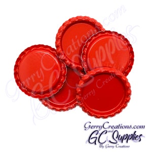 May include: A close-up of six red bottle caps. The caps are made of metal and have a smooth, shiny finish.