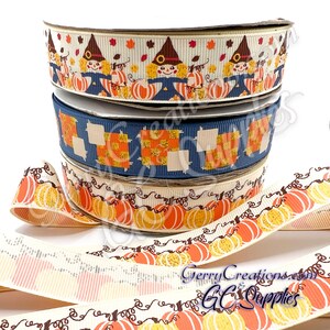 May include: A stack of decorative ribbons with fall-themed patterns. The top ribbon features scarecrows and pumpkins, the middle one has patchwork designs, and the bottom ribbon displays pumpkins with vines. The ribbons are in various colors, including cream, navy, orange, and brown.