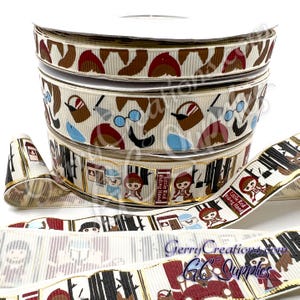 May include: Spools of decorative ribbon featuring Little Red Riding Hood illustrations. The ribbon has a cream background with repeating images of the wolf, Little Red Riding Hood, and other story elements. The text "Little Red Riding Hood" is also visible on the ribbon.