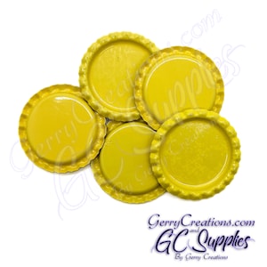 May include: Five yellow metal bottle caps with a scalloped edge.
