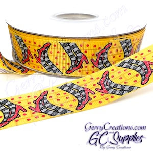 May include: Yellow ribbon with a repeating pattern of red shoes with black and white striped stockings. The ribbon has small red dots on it.