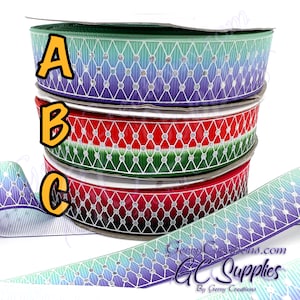 May include: Three rolls of patterned ribbon with a white diamond pattern and a gradient of colors. The top roll is teal to purple, the middle roll is green to red, and the bottom roll is black to red.