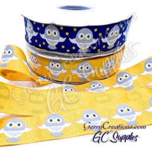 May include: Ribbon rolls in blue and yellow with an owl pattern. The ribbon features a repeating design of gray owls with outstretched wings. The yellow ribbon has a vertical ribbed texture. The text "GerryCreations.com GC Supplies" is visible on the ribbon.
