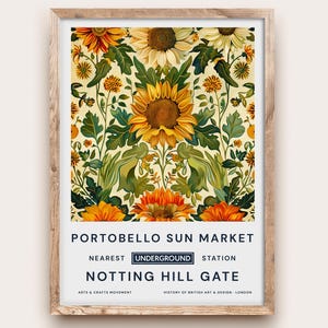 May include: A framed print featuring a floral design with sunflowers in shades of yellow, orange, and green. The print includes the text "Portobello Sun Market" and "Notting Hill Gate". The artwork is in a wooden frame.