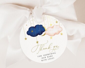 May include: Round thank you tag with a blue and pink cloud design and gold stars and a crescent moon. The text reads "Thank you for showering our baby with love!"