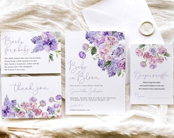 May include: A set of four baby shower invitations with a watercolor floral design in shades of purple and pink. The invitations feature the text "Baby in Bloom" and "Books for baby" and "Diaper Raffle".