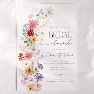 Bridal shower invitation with colorful wildflowers arch and cursive writing. The invite includes watercolor illustration of soft summer wildflowers in pink, yellow, blue, purple, red and white tones. The text includes bridal brunch as it's title.