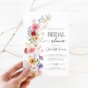 Wildflower bridal shower bundle including invitation, recipe card, registry card and recipe request card. The invitation includes colorful watercolor wildflower illustration in pink, purple, yellow, red and green shades and modern calligraphy text style and simple white background. The text read "bridal shower". The size of the invitation is 5x7 inches, recipe card and registry card are 3.5x5 inches and recipe request card is 2x3.5 inches.