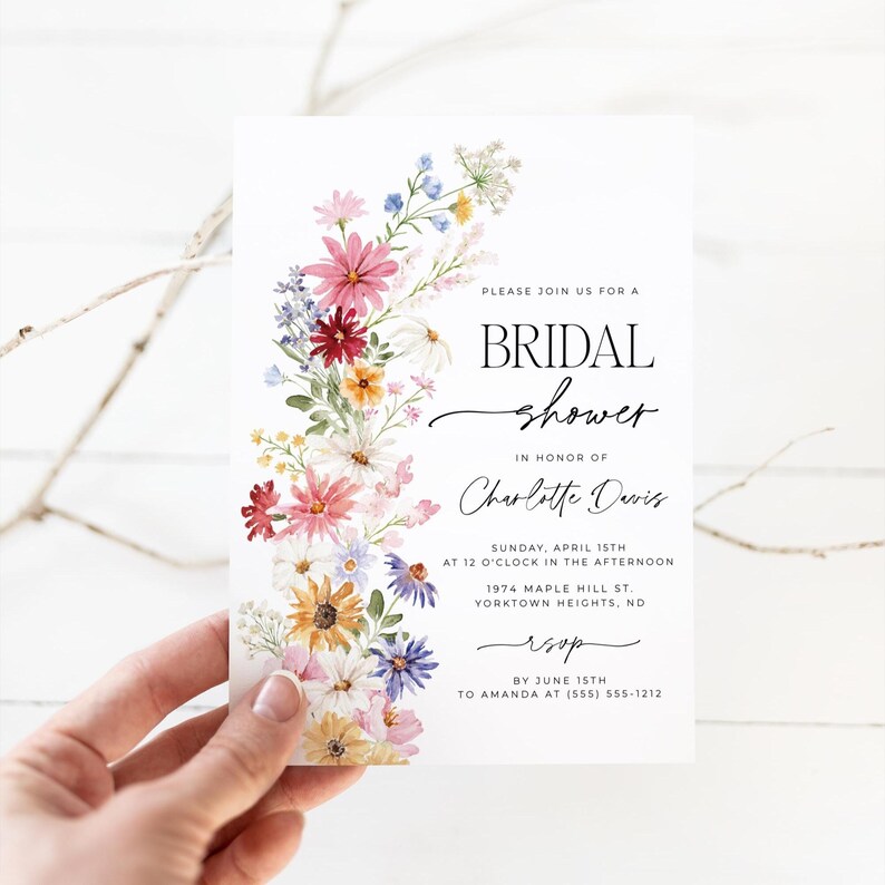 Wildflower bridal shower bundle including invitation, recipe card, registry card and recipe request card. The invitation includes colorful watercolor wildflower illustration in pink, purple, yellow, red and green shades and modern calligraphy text style and simple white background. The text read "bridal shower". The size of the invitation is 5x7 inches, recipe card and registry card are 3.5x5 inches and recipe request card is 2x3.5 inches.