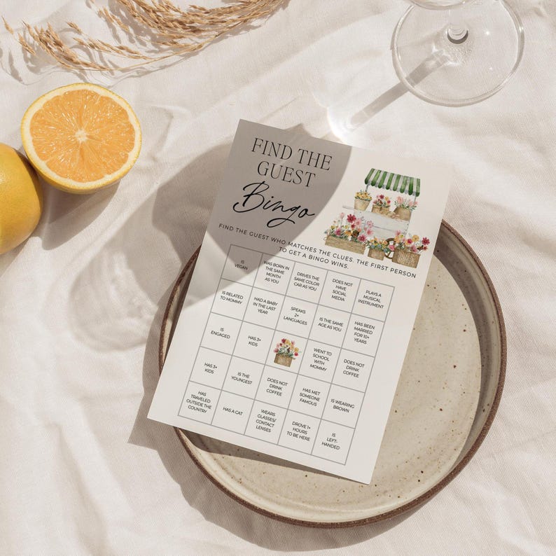 May include: A printable bingo card with a floral theme. The card has a title that says "Find the Guest Bingo". The card has 25 squares with different clues to find a guest who matches the clues. The first person to get a bingo wins.