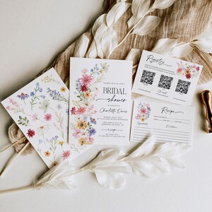 Wildflower bridal shower bundle including invitation, recipe card, registry card and recipe request card. The invitation includes colorful watercolor wildflower illustration in pink, purple, yellow, red and green shades and modern calligraphy text style and simple white background. The text read "bridal shower". The size of the invitation is 5x7 inches, recipe card and registry card are 3.5x5 inches and recipe request card is 2x3.5 inches.