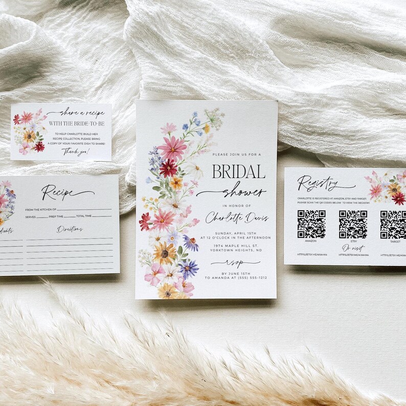 Wildflower bridal shower bundle including invitation, recipe card, registry card and recipe request card. The invitation includes colorful watercolor wildflower illustration in pink, purple, yellow, red and green shades and modern calligraphy text style and simple white background. The text read "bridal shower". The size of the invitation is 5x7 inches, recipe card and registry card are 3.5x5 inches and recipe request card is 2x3.5 inches.