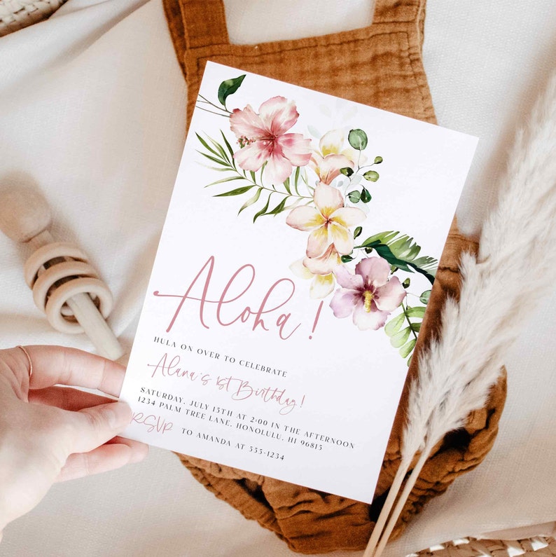 May include: A white invitation with pink floral illustrations and the text "Aloha!"  Hula on over to celebrate Alane's 1st Birthday! Saturday, July 15th at 2:00 in the afternoon. 1234 Palm Tree Lane, Honolulu, HI 96813. RSVP to Amanda at 555-1234.