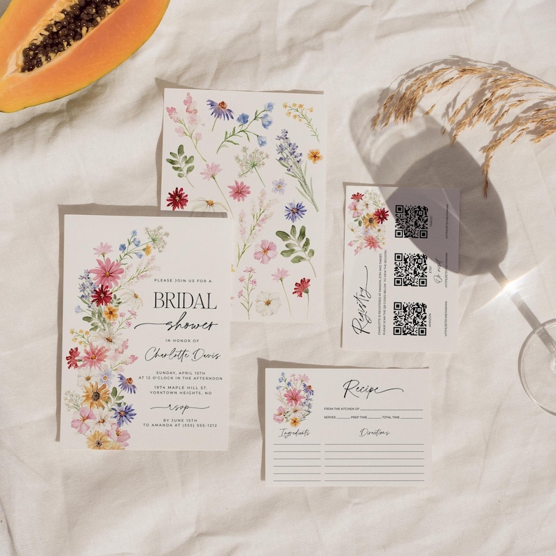 Wildflower bridal shower bundle including invitation, recipe card, registry card and recipe request card. The invitation includes colorful watercolor wildflower illustration in pink, purple, yellow, red and green shades and modern calligraphy text style and simple white background. The text read "bridal shower". The size of the invitation is 5x7 inches, recipe card and registry card are 3.5x5 inches and recipe request card is 2x3.5 inches.