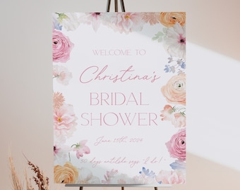 Puede incluir: Un cartel de despedida de soltera blanco con un borde floral. El texto dice "Bienvenido a Christina's Bridal Shower 15 de junio de 2024 50 días hasta que diga 'Sí'!".