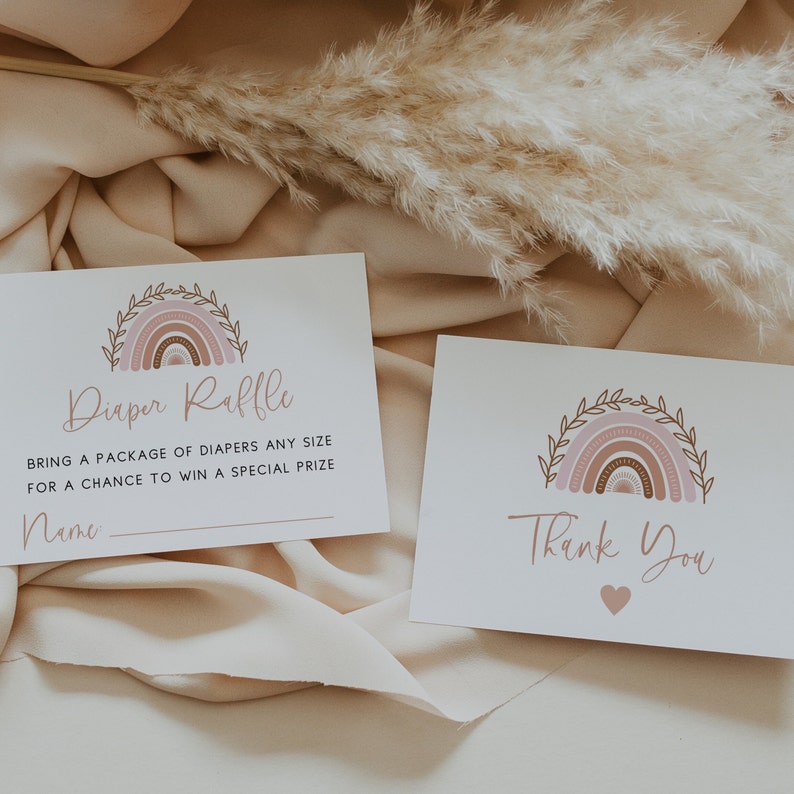 May include: A white card with a pink and brown rainbow design and the text "Diaper Raffle" and "Bring a package of diapers any size for a chance to win a special prize".  The card also has a blank line for a name.  A second white card with a pink and brown rainbow design and the text "Thank You" with a small pink heart.