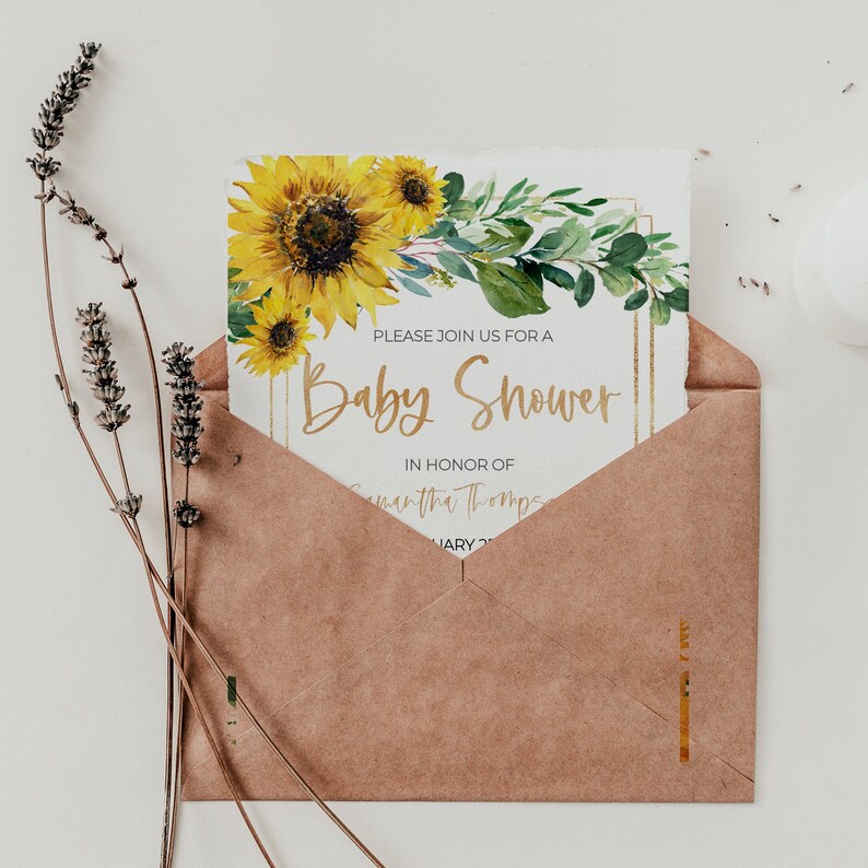 May include: A brown envelope with a white card inside. The card has a watercolor illustration of sunflowers and greenery. The text on the card reads "Please join us for a Baby Shower in honor of Samantha Thompson".