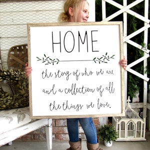 HOME a collection of who we are and a collection of all the things we love Framed Farmhouse Quote Sign