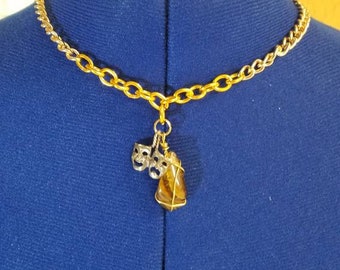 Two tone gold chain pendant necklace with comedy and drama masks charm and tiger's eye stone charm.