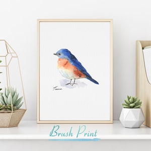 May include: Watercolor painting of a bluebird with a blue head, orange chest, and a white belly. The bird is perched on a branch with its wings folded. The painting is signed "Tacoe" in the bottom left corner.