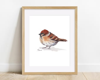 May include: Watercolor painting of a brown and white sparrow with a red head, perched on a white surface. The painting is framed in a light brown wood frame.