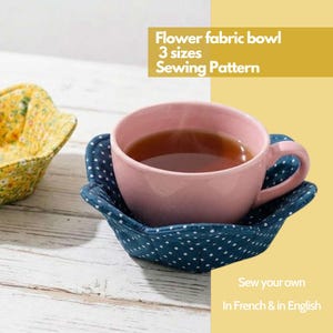 Puede incluir: Un juego de tres tazas de cerámica con acabado mate y moteado. Las tazas son de color crema, gris claro y gris oscuro. Cada taza tiene un diseño simple y minimalista.