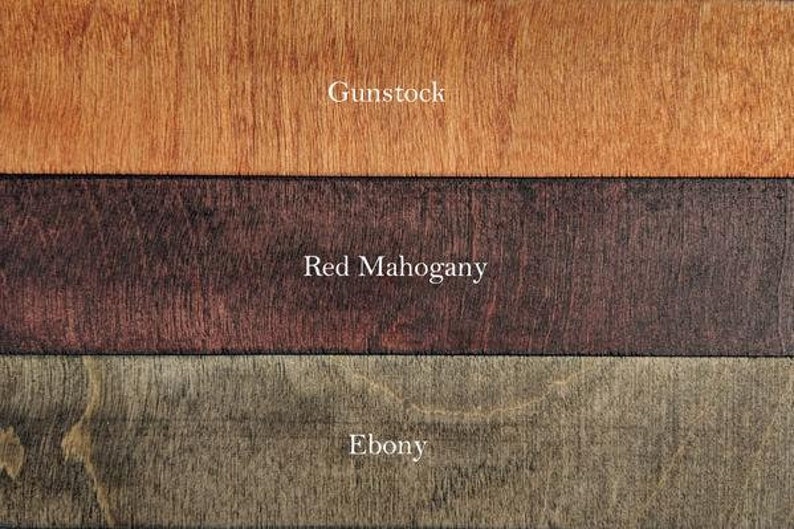 May include: Three wood samples showing different wood stains: Gunstock, Red Mahogany, and Ebony.