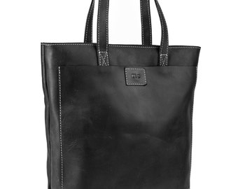 May include: Black leather tote bag with white stitching and a small pocket on the front. The bag has two top handles and the letters "TMC" are embossed on the front pocket.