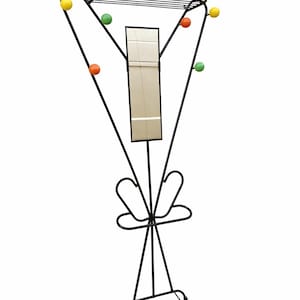 May include: A black metal coat stand with a geometric design. It features a top shelf, a central mirror, and colourful ball accents in yellow, green, and orange. The stand has a shoe rack at the base.