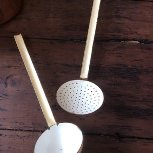 old skimmer and ladle in enamelled sheet metal vintage french enamelware