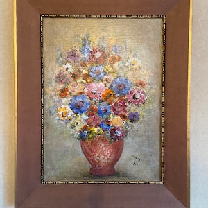 May include: A framed painting of a bouquet of colorful flowers in a pink vase. The flowers are mostly pink, blue, and yellow. The painting is signed "Mady 2013".