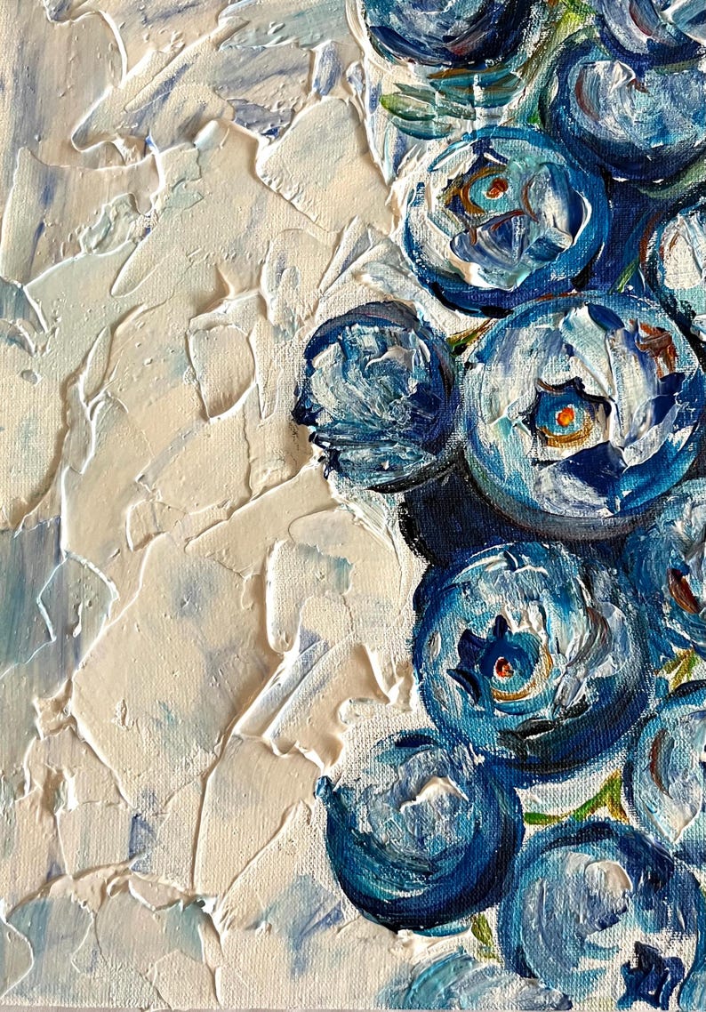 May include: Close-up of an abstract painting featuring textured white and blue brushstrokes. The artwork depicts a cluster of stylized blue flowers with detailed petals and a creamy white background. The painting has a thick, impasto style.