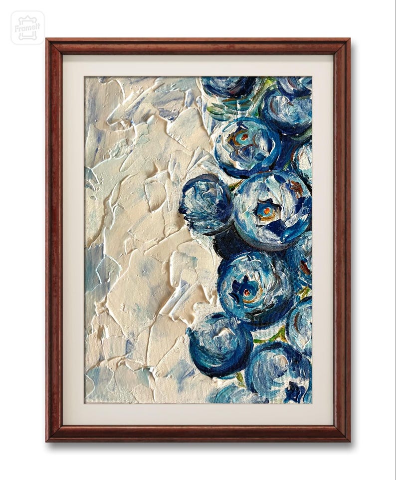 May include: A framed painting featuring a close-up of blueberries. The artwork showcases a textured, impasto style with shades of blue and white. The blueberries are clustered together, set against a textured white background, and framed in a dark brown wooden frame.